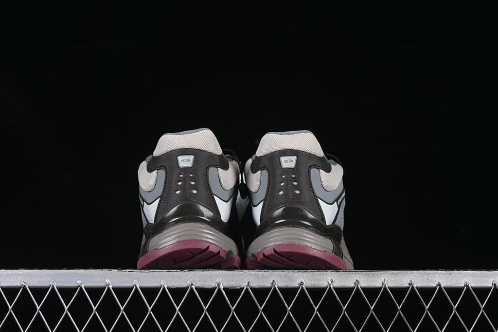 Rear view of the pair showing heel panels and berry-colored outsole edges.