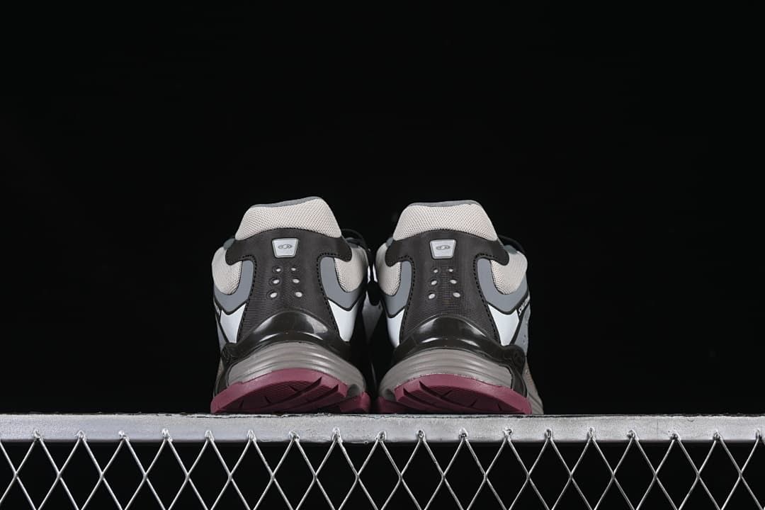 Rear view of the pair showing heel panels and berry-colored outsole edges.