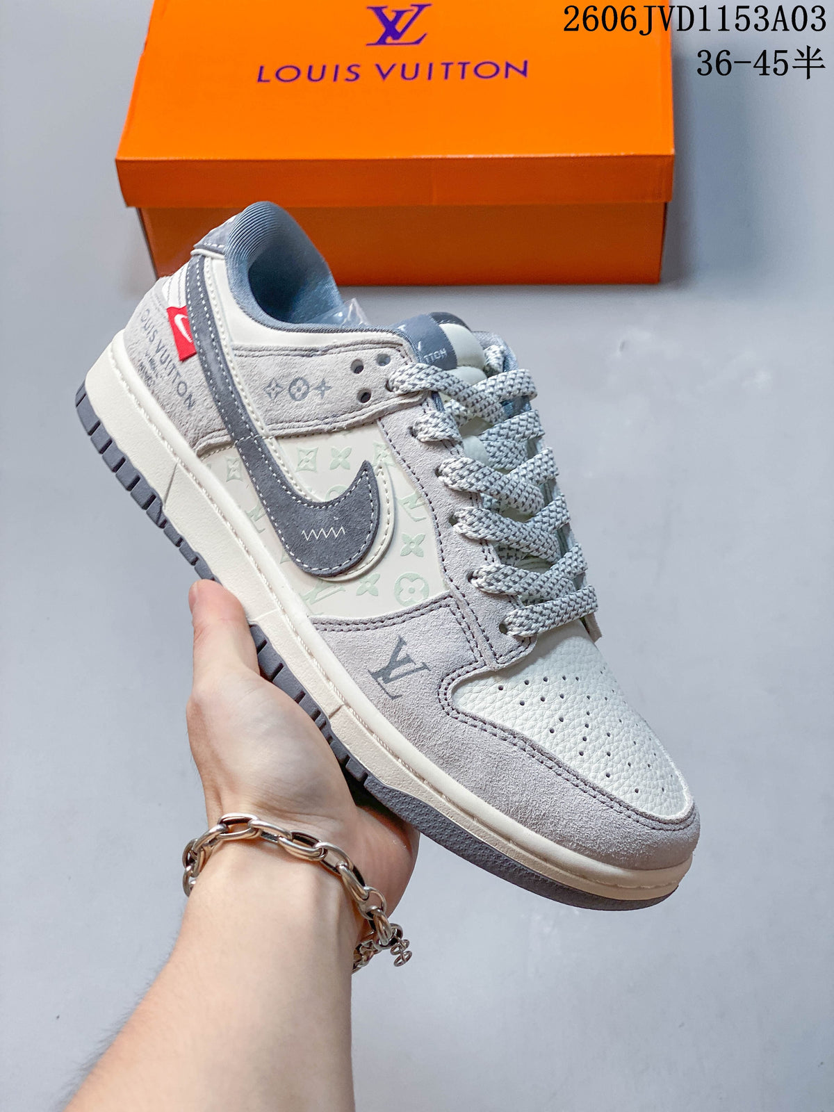 Light gray low-top sneaker with patterned side panels, layered swoosh-shaped detail, and gray laces