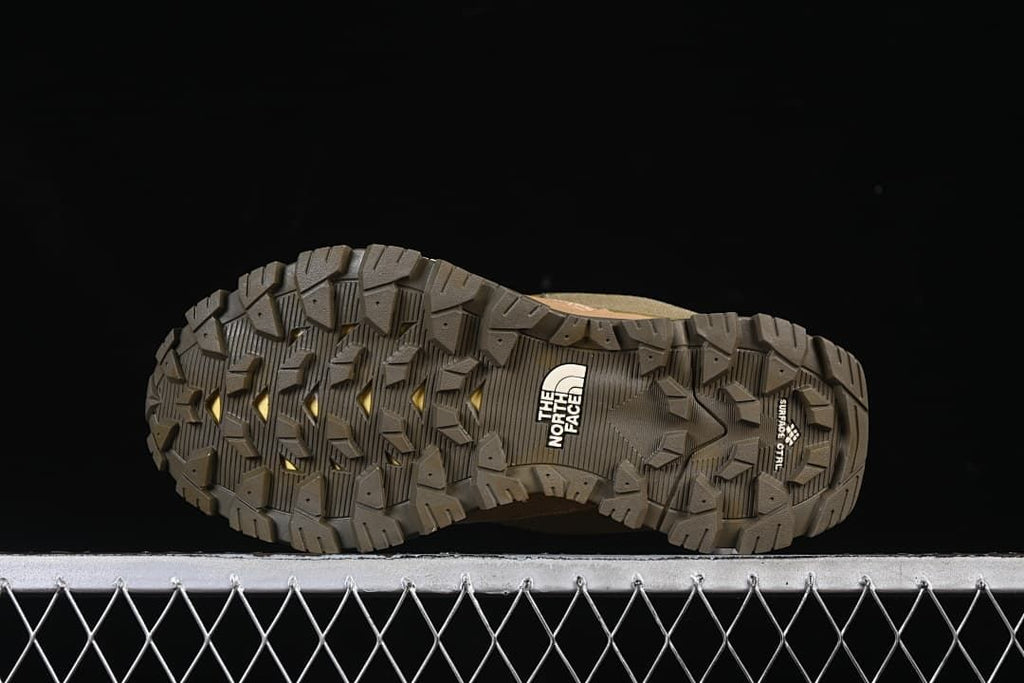 Underside view showing the lugged outsole