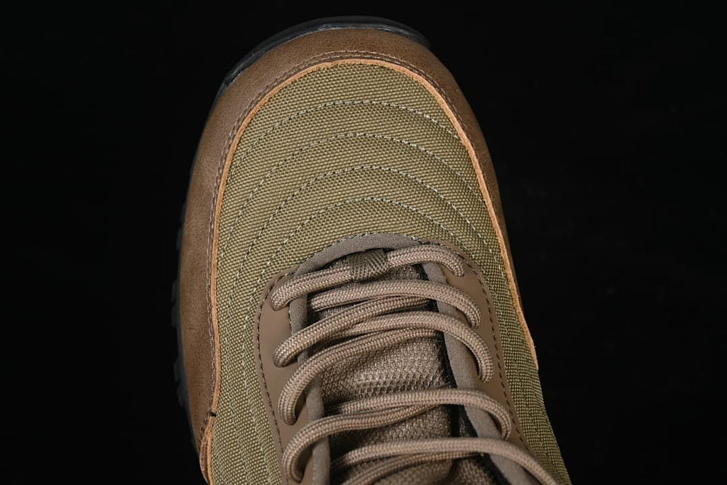 Top view highlighting the olive toe panels and brown lace-up section.