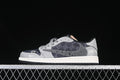 Side view of gray and dark patterned low-top sneakers with a speckled side Swoosh and light midsole