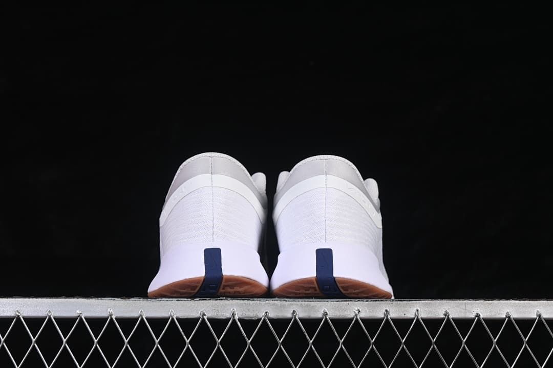 Rear view of the pair with navy heel accents and gum outsoles.