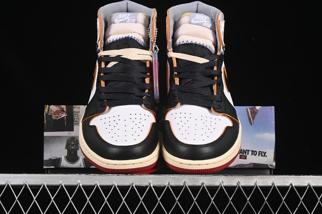 Front view of both sneakers showing white toe boxes and black laces