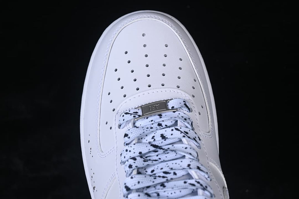 Top view of the perforated toe and speckled laces