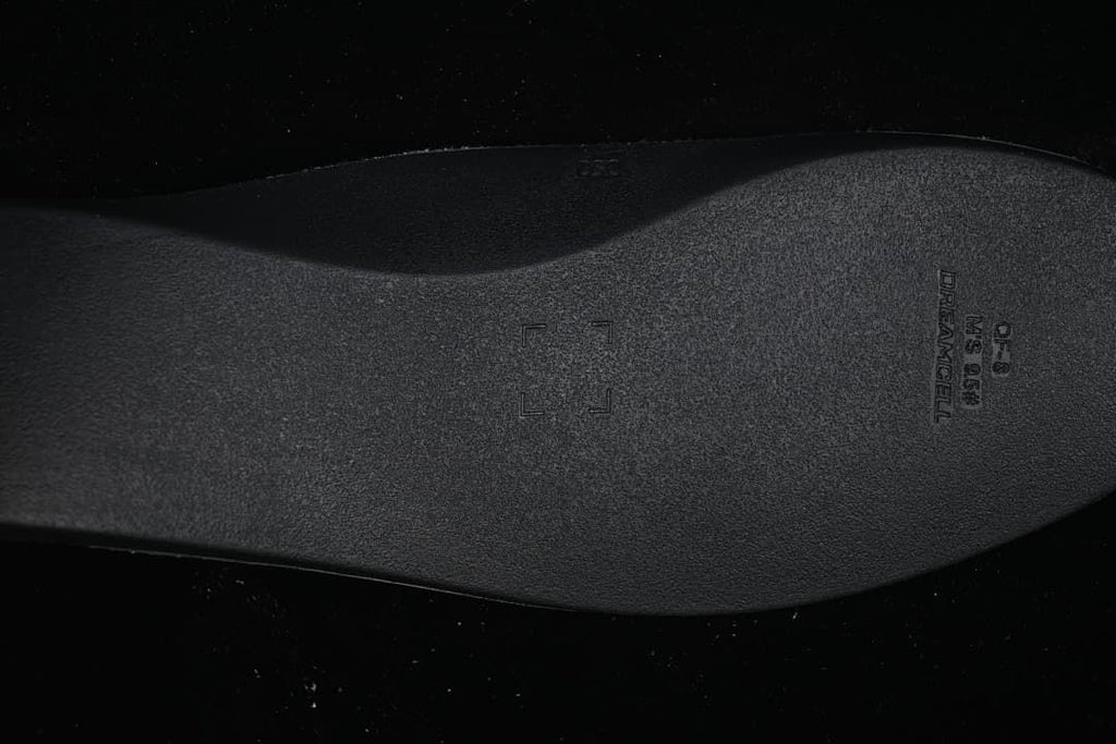 Close-up of the dark insole with embossed lettering