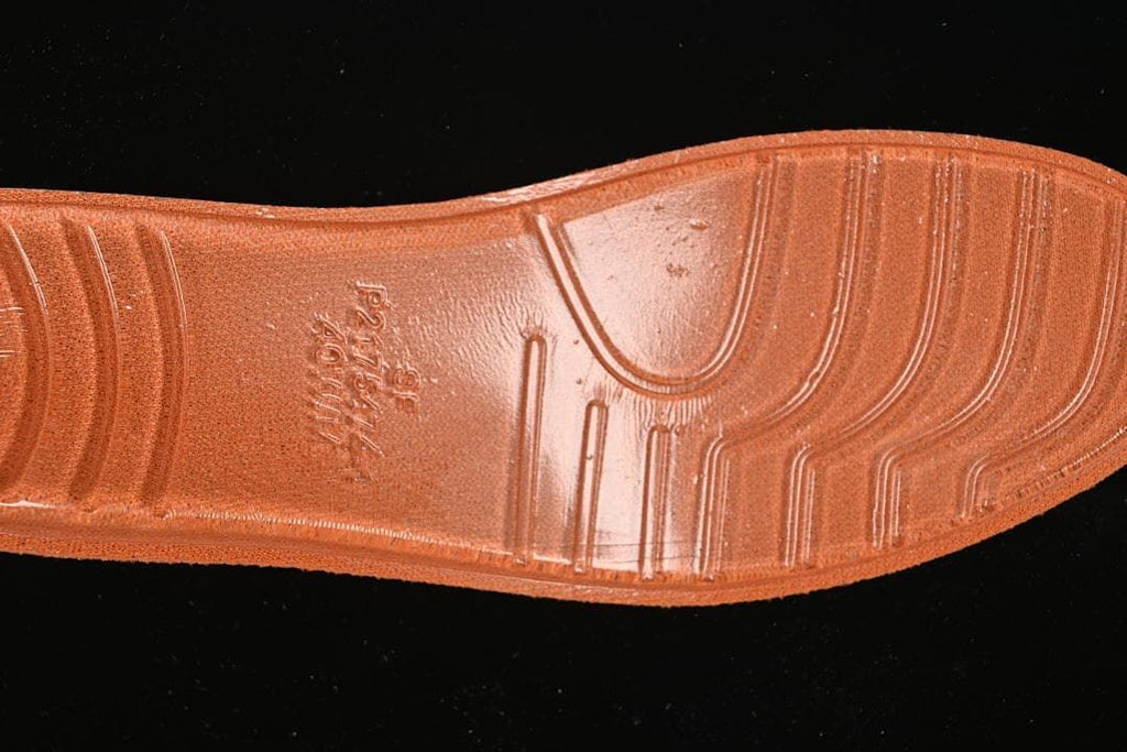 Close-up of the orange sneaker outsole