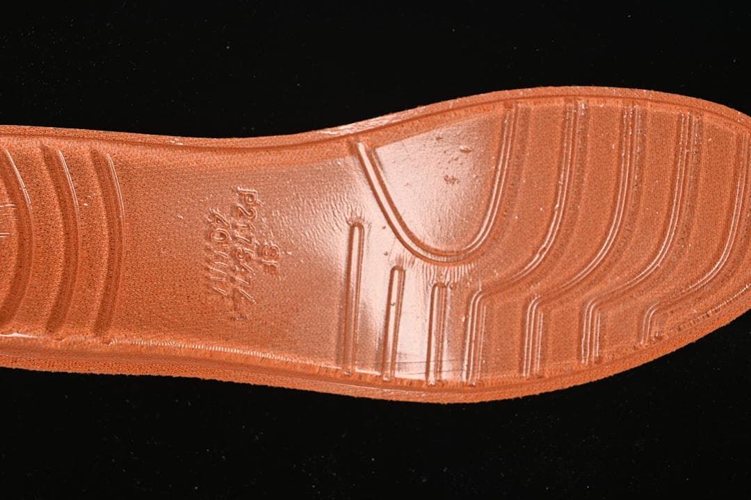Close-up of the orange sneaker outsole