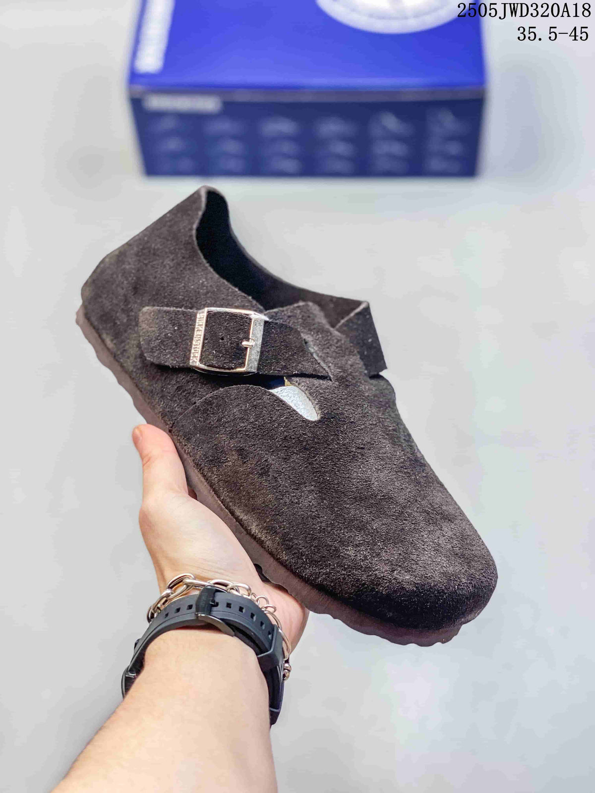 Dark brown closed-toe clog with two buckle straps; a box is visible in the background.