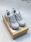 Gray ASICS GEL-NYC RGD sneakers shown as a pair on a shoe box