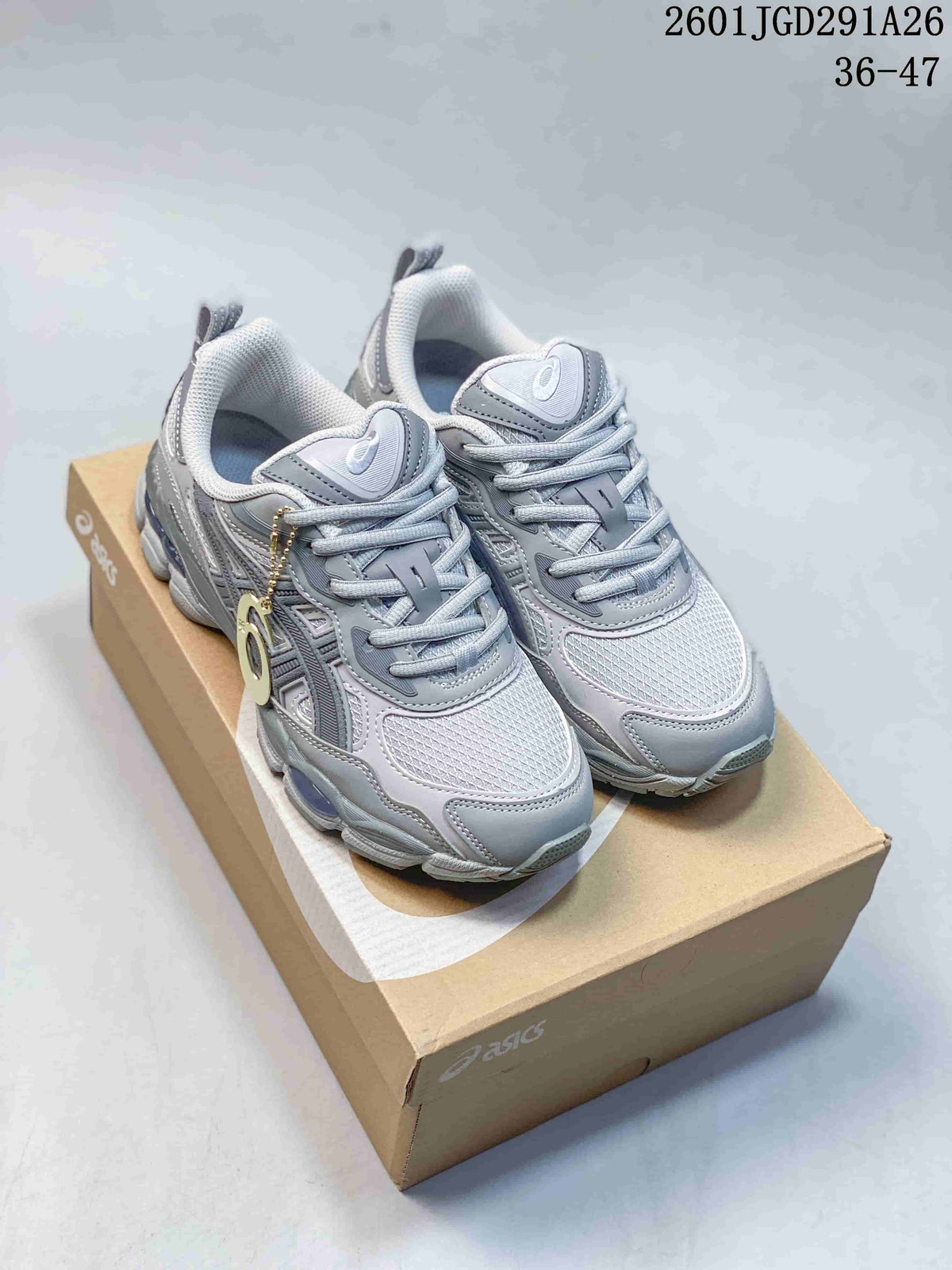 Gray ASICS GEL-NYC RGD sneakers shown as a pair on a shoe box