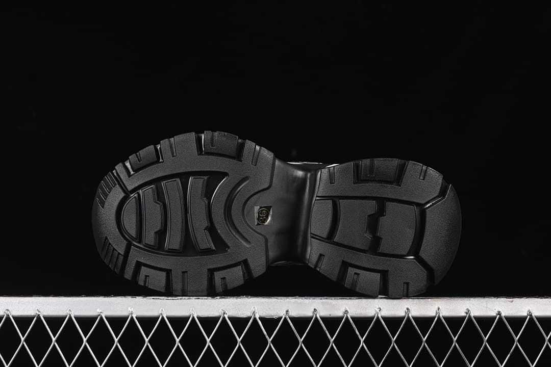 Underside view showing the black treaded outsoles