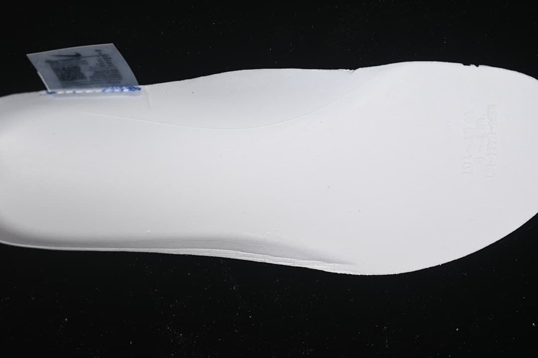 Close-up view of the white shoe midsole