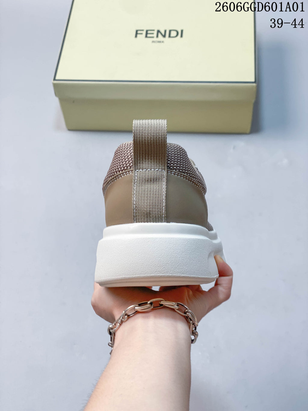 Rear view showing the sneaker heel, pull tab and thick white sole