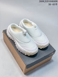 Pair of pale white The North Face ThermoBall Traction Mule V slip-ons displayed on a shoebox