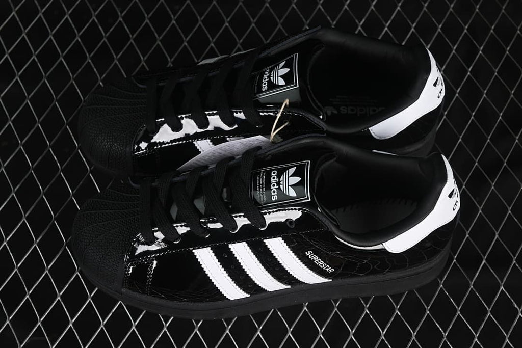 Pair of black and white adidas Superstar II sneakers viewed from above