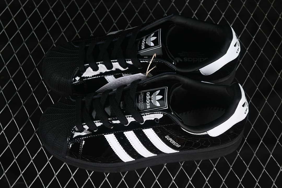 Pair of black and white adidas Superstar II sneakers viewed from above