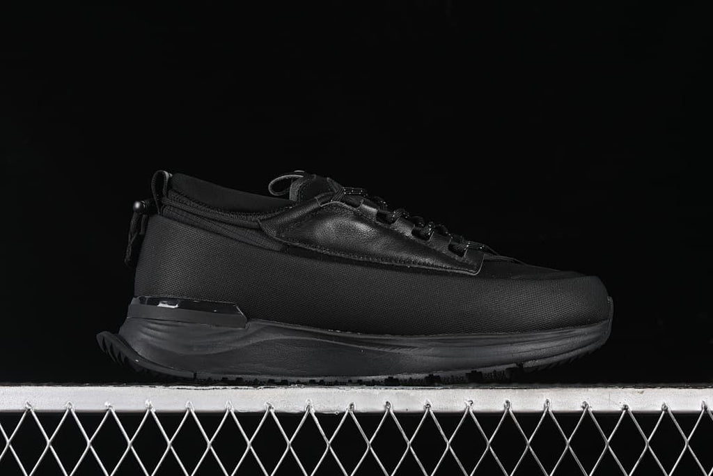 Side profile of the black sneaker