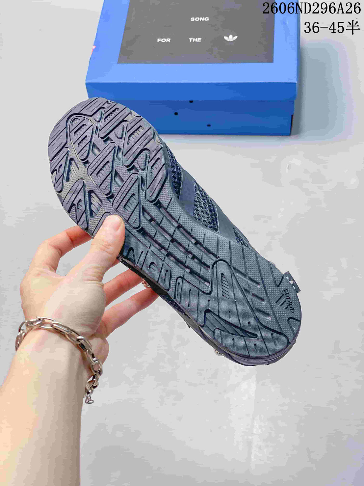 Close-up of the patterned outsole on a dark gray sneaker