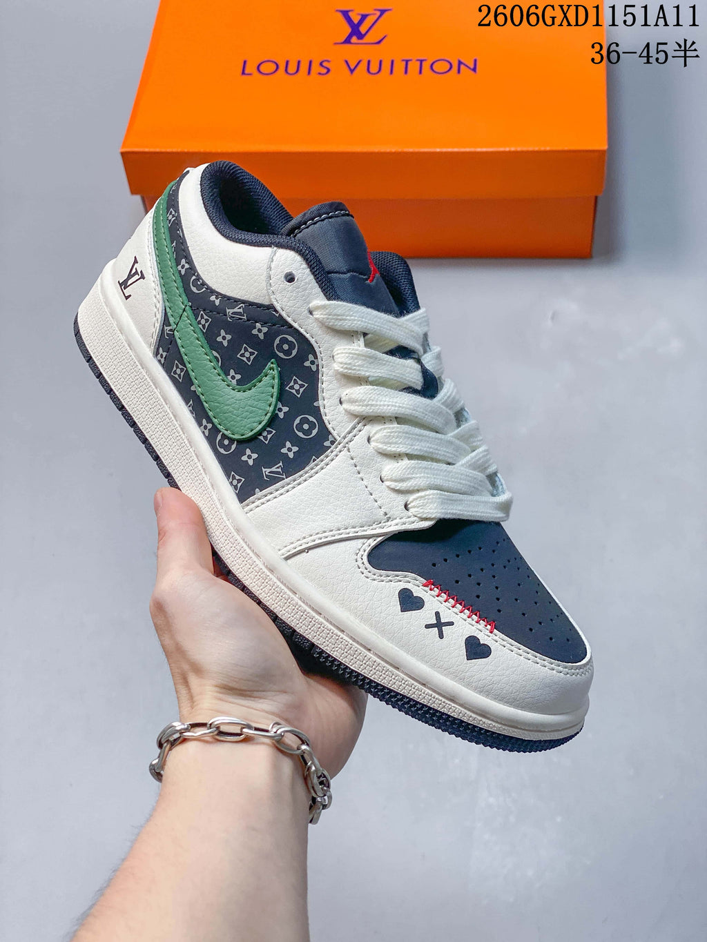 Angled side view of the white, navy, and green low-top sneaker.