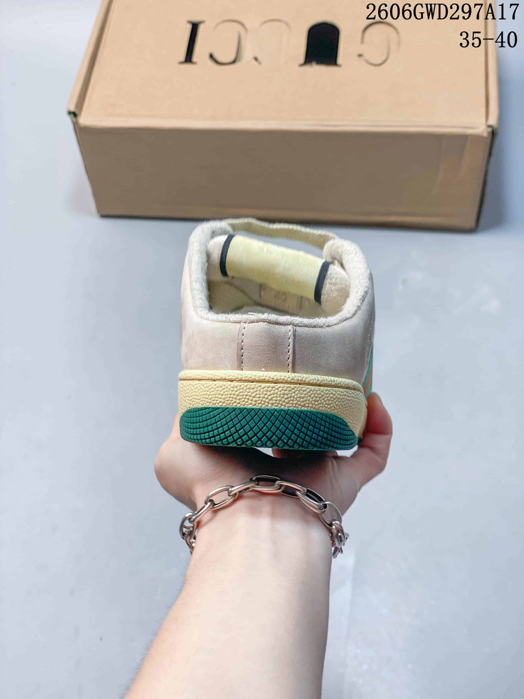 Rear view showing the open-back mule design and contrasting outsole