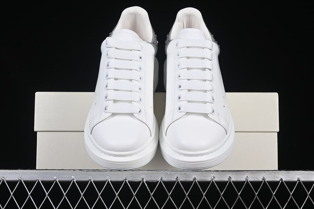 Front view of the pair showing rounded toes and white laces.