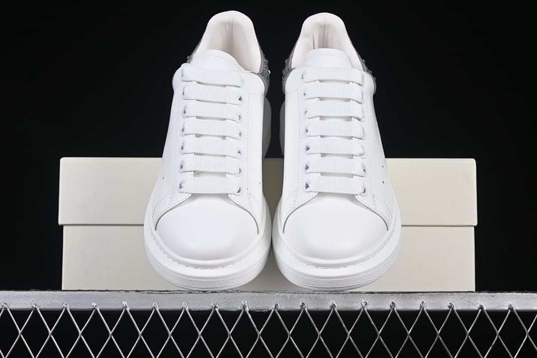 Front view of the pair showing rounded toes and white laces.