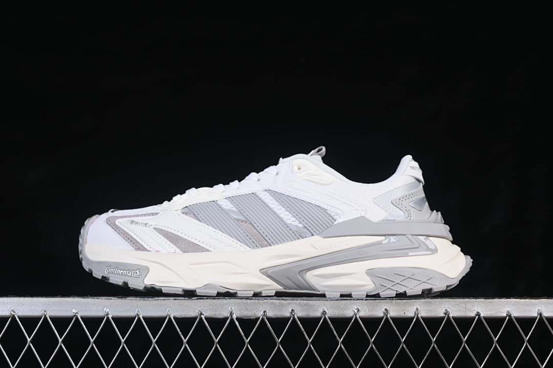 Side view of a white and grey adidas XLG Storm Edge sneaker
