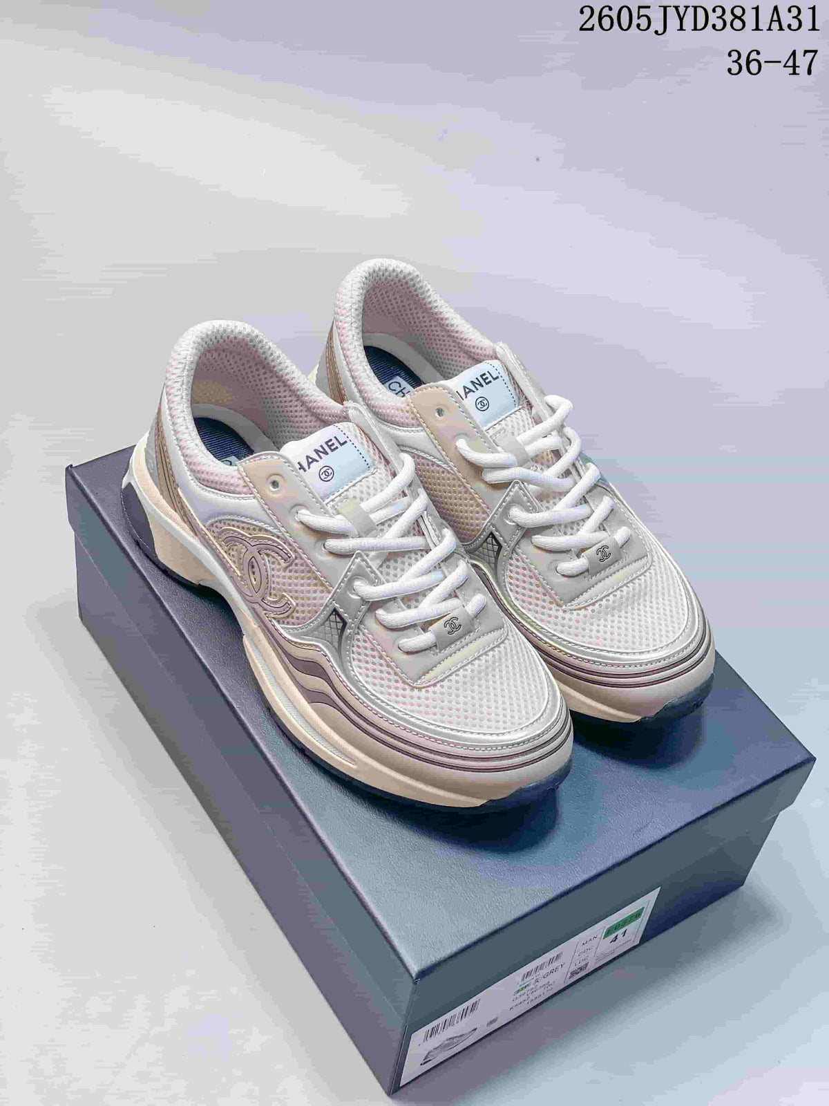 Pair of cream and blush-toned chunky lace-up sneakers with mesh panels and thick soles