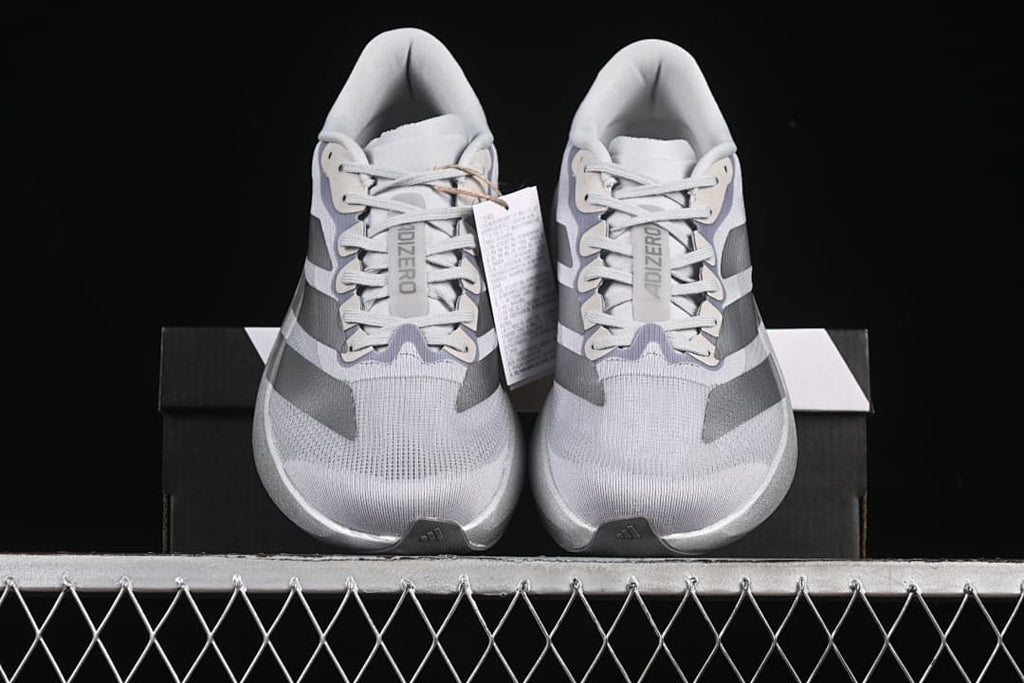 Front view of the pair, showing the toe shape, laces, and stripe details.