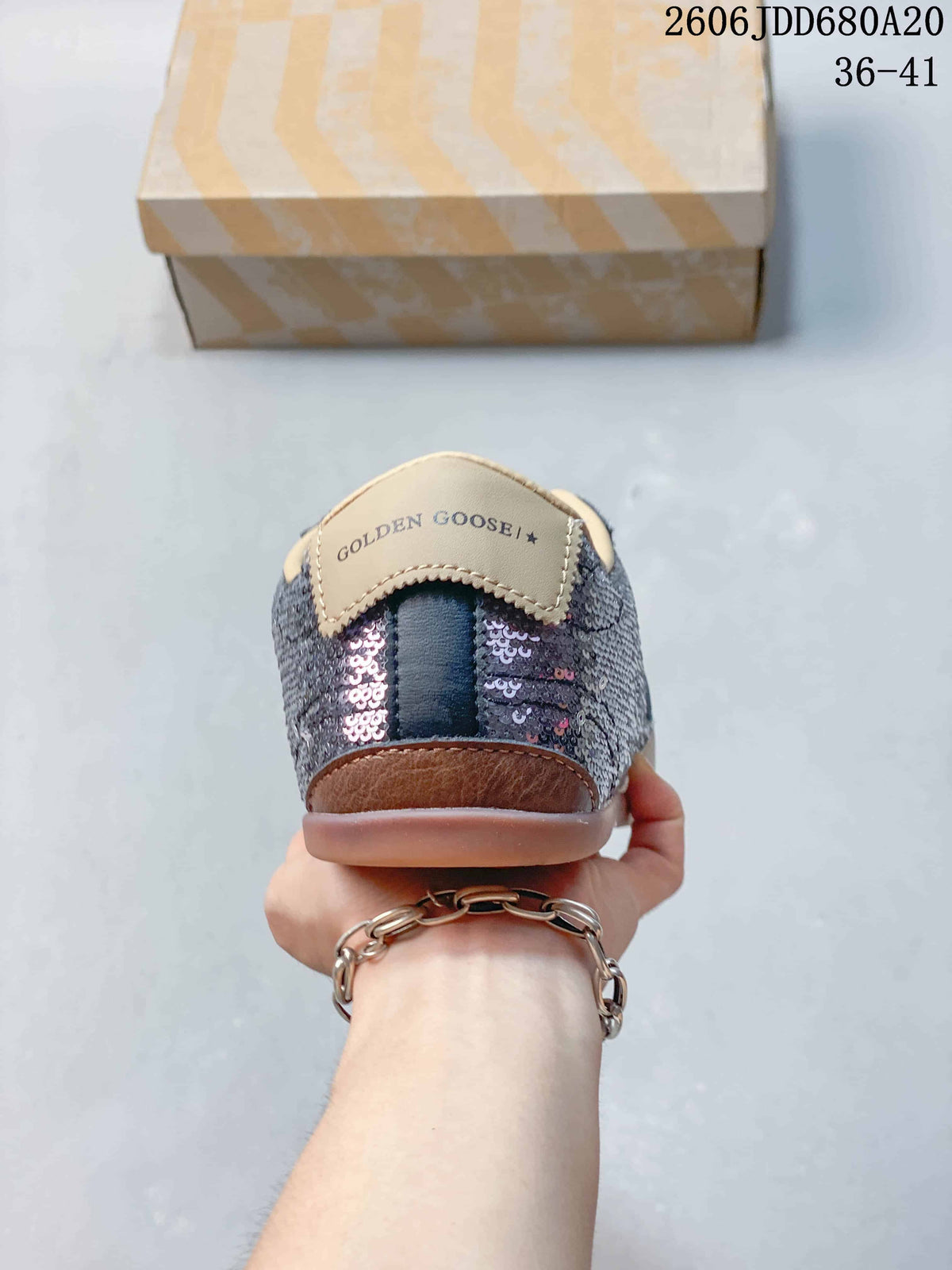 Rear view of the sequin sneaker with heel detail and sole