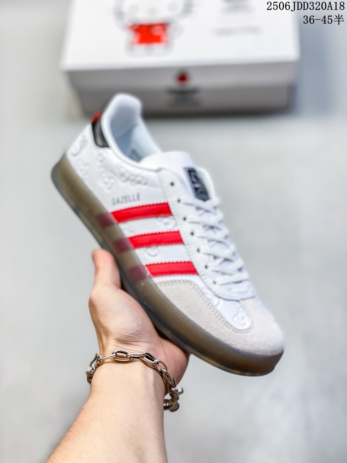 Angled side view of the white and red low-top sneakers