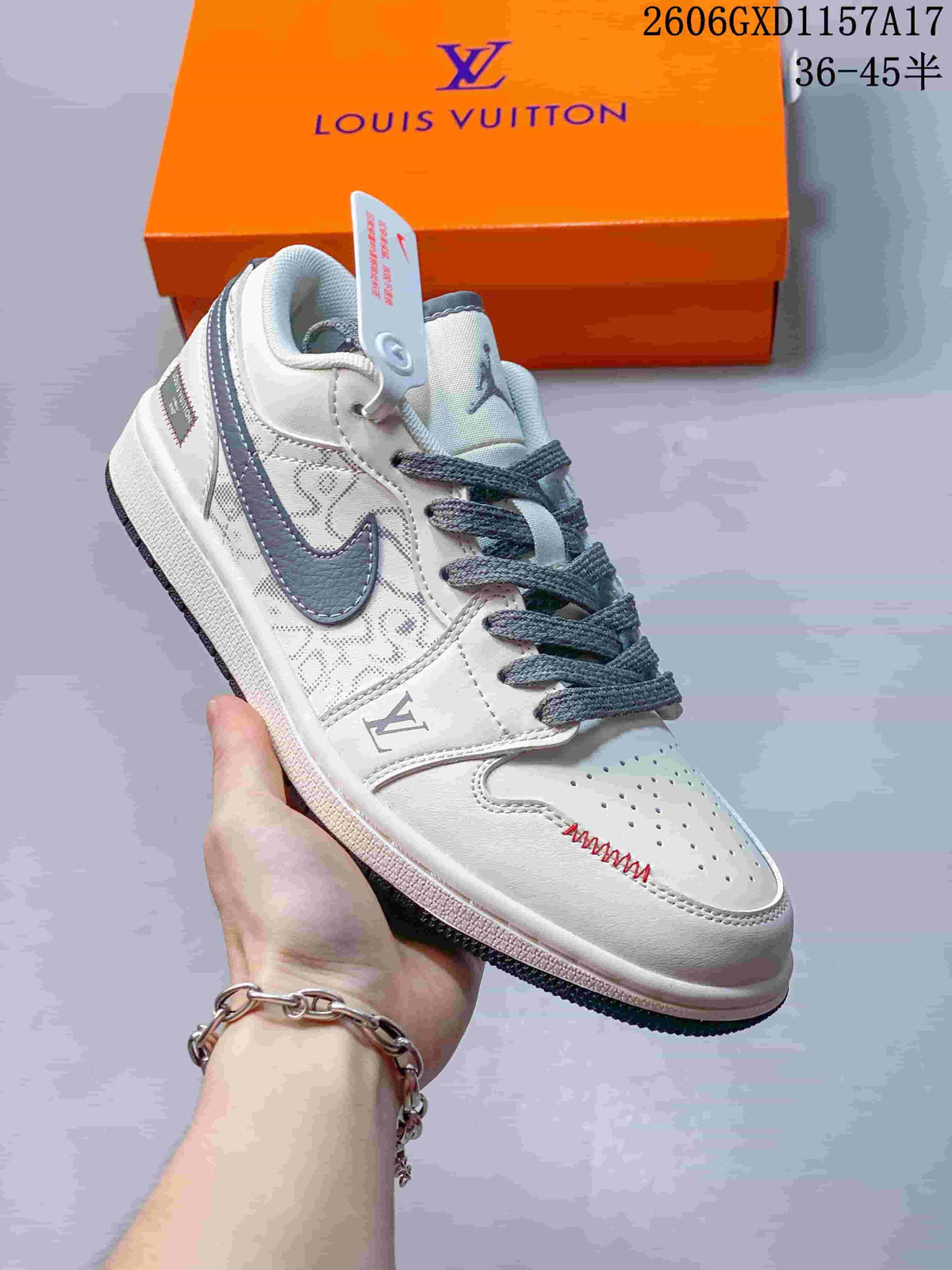 Angled view of the cream and grey low-top sneaker with patterned side panels