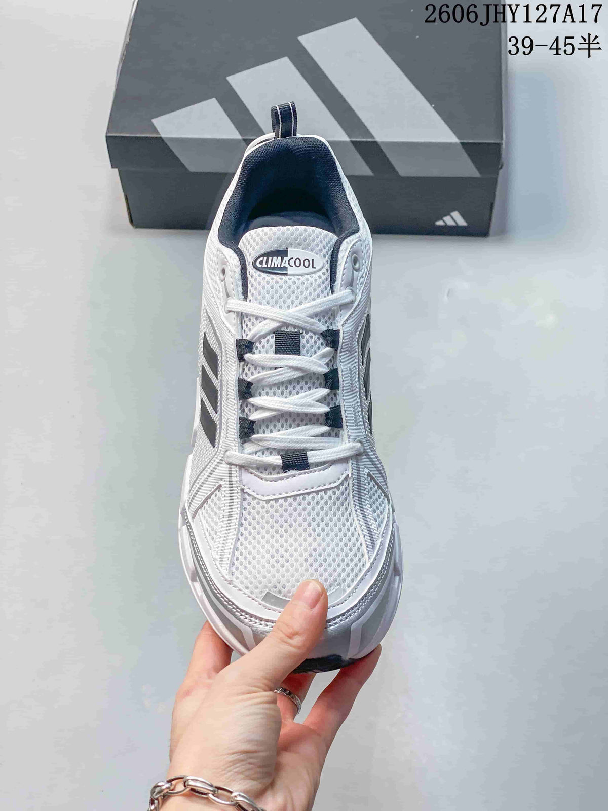 Front view of the sneaker showing the mesh-look toe and lace-up closure