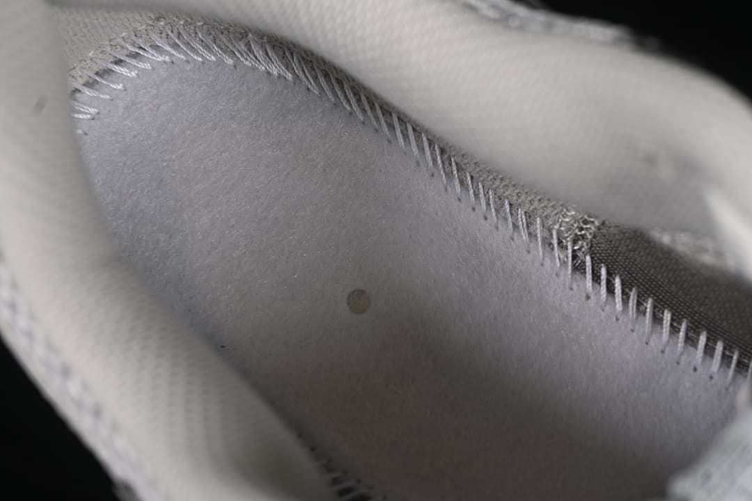 Close-up of the shoe interior lining and stitching.