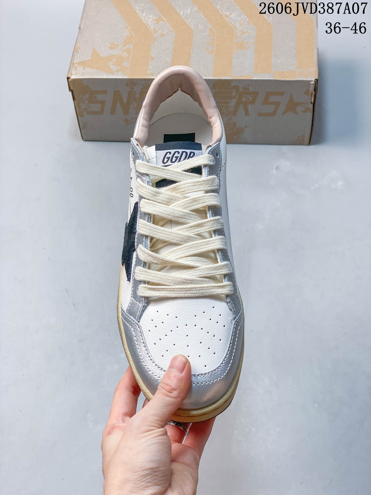 Top view of the sneaker showing its perforated toe, cream laces, and silver overlays