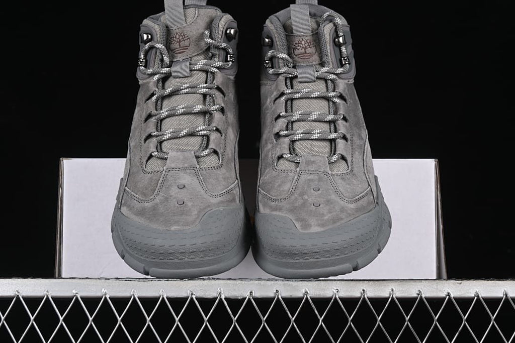 Front view of the pair with lace-up closures and rounded toe guards