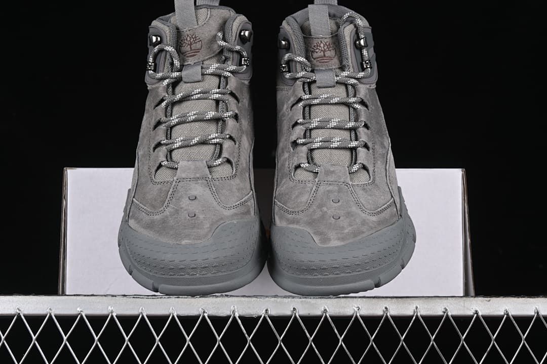 Front view of the pair with lace-up closures and rounded toe guards