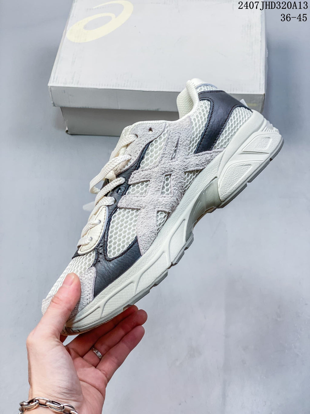 Side profile showing the layered upper and sculpted sole of the sneaker