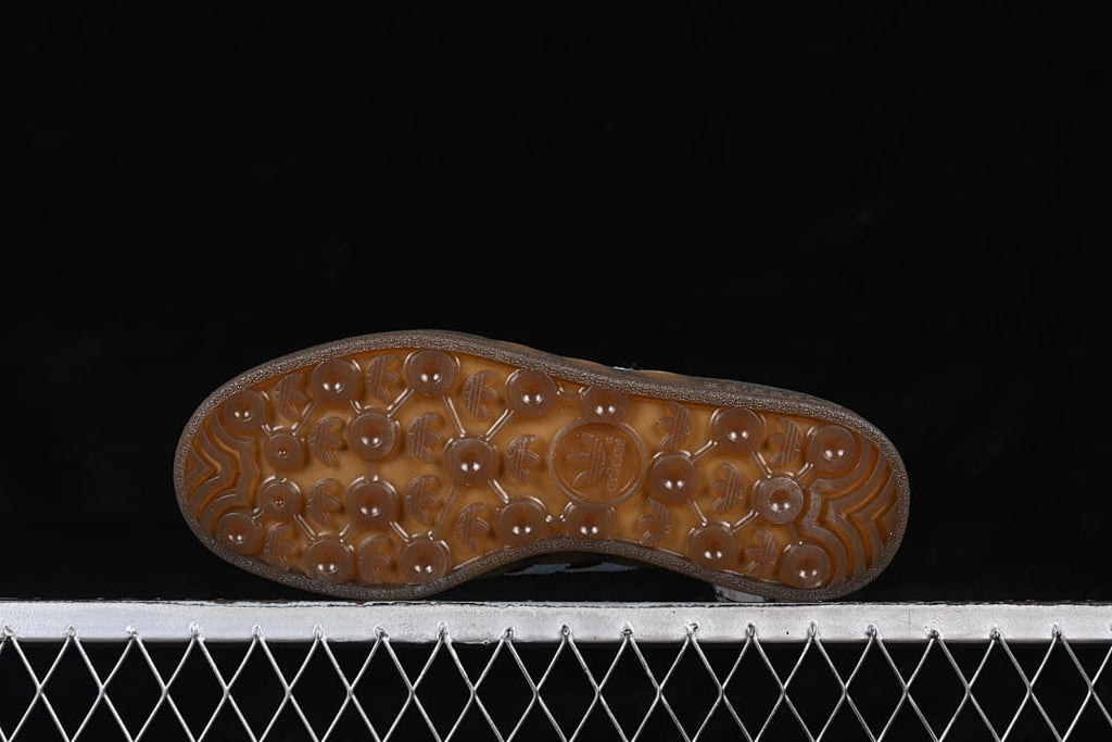 Underside of the translucent brown gum outsole with patterned tread