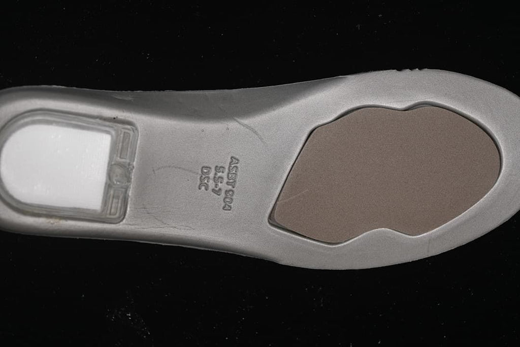 Underside of the sneaker insole with molded markings