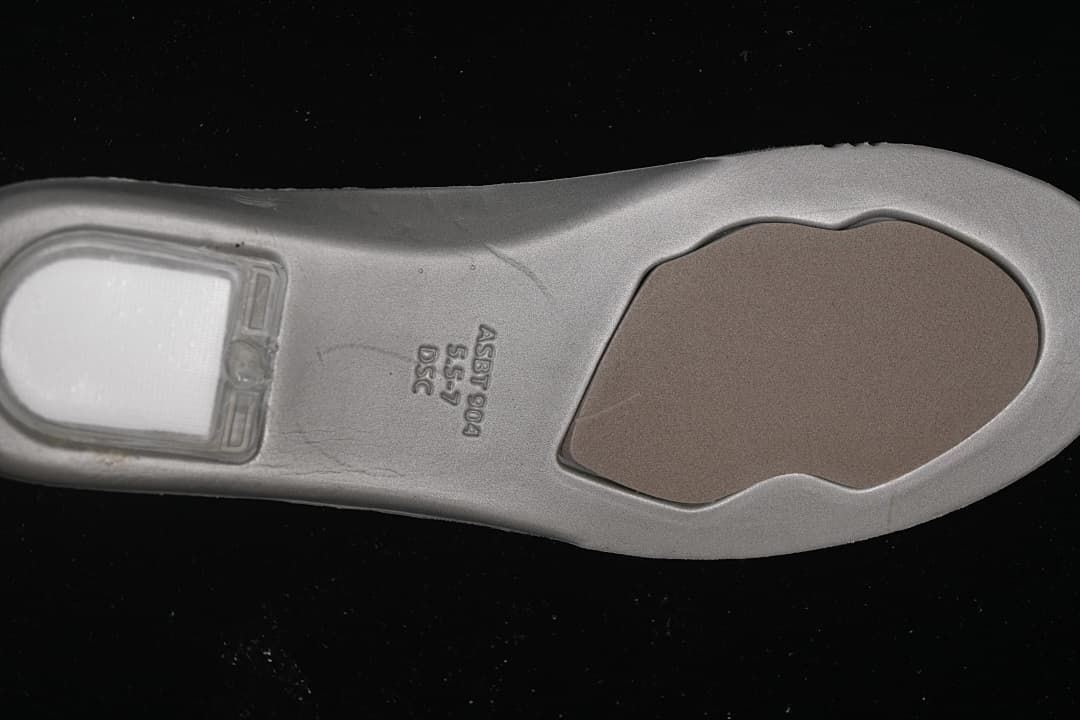 Underside of the sneaker insole with molded markings