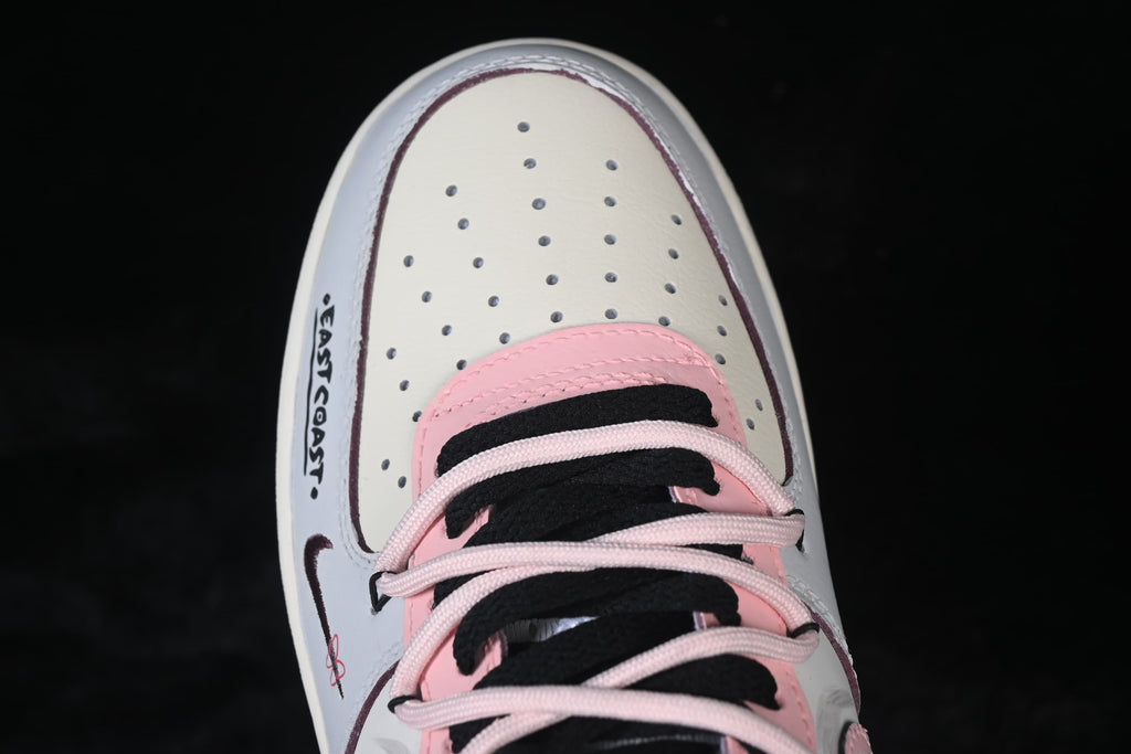 Close-up of perforated toe panel and layered laces