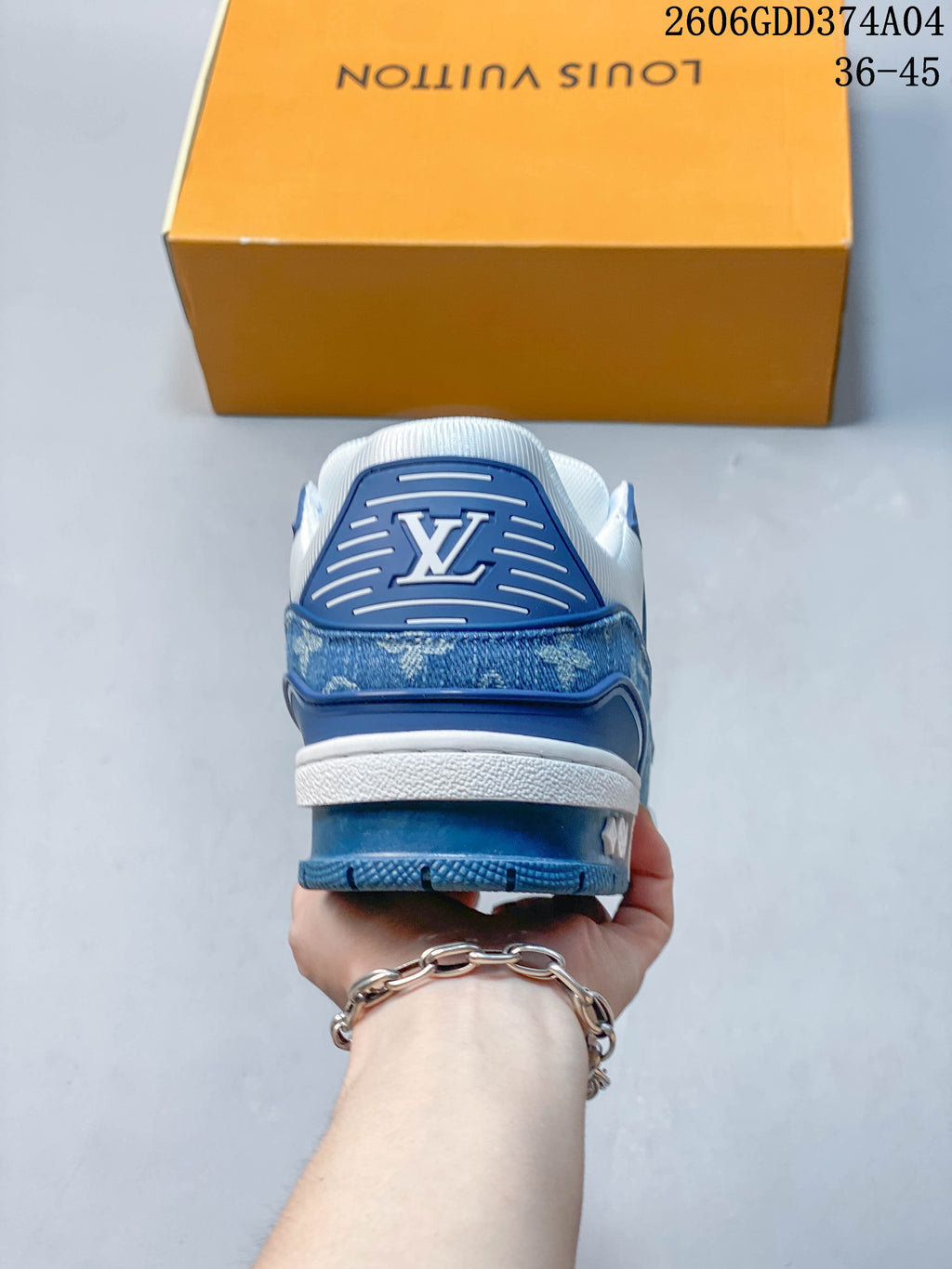 Rear view of the sneaker with blue heel detailing