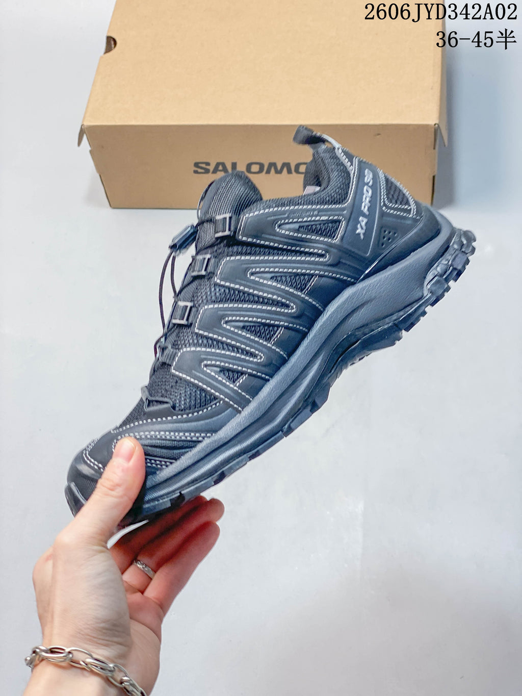 Side view of a dark gray Salomon XA Pro 3D trail running shoe