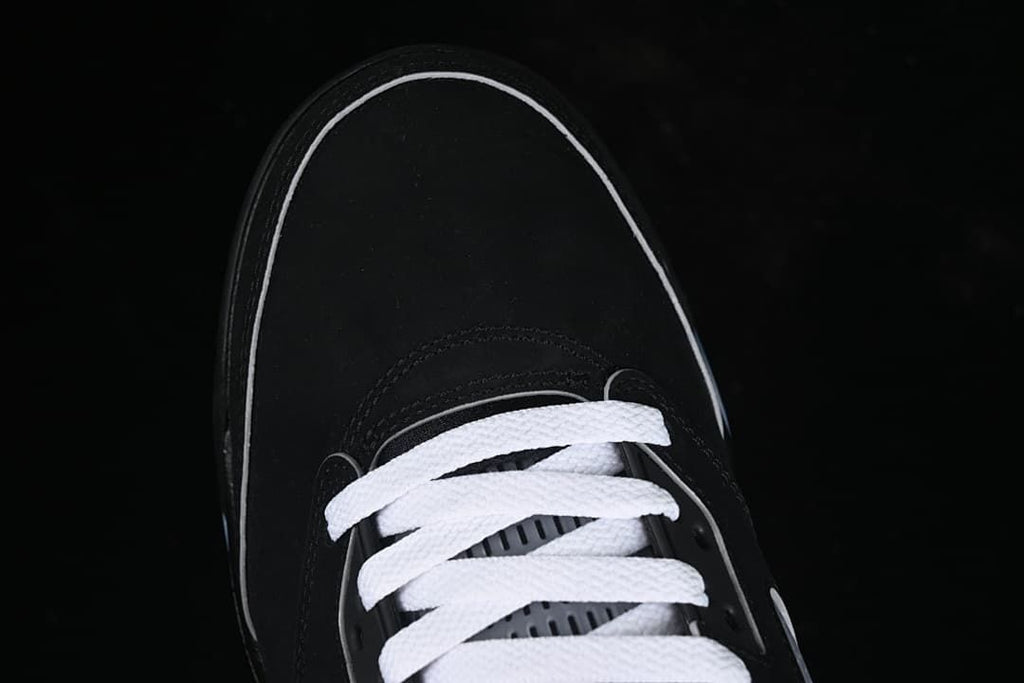 Top view of the black toe and white laces