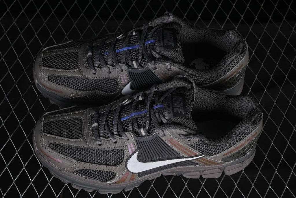 Pair of grey Nike Zoom Vomero 5 sneakers viewed from above