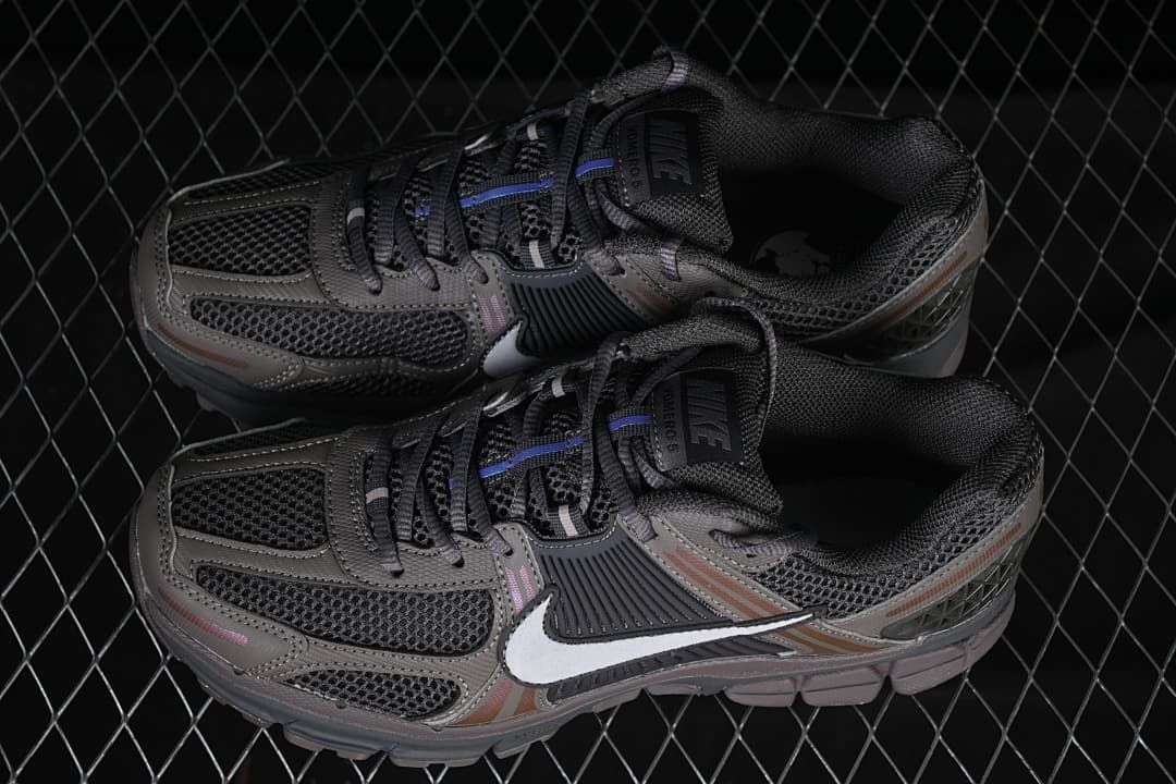 Pair of grey Nike Zoom Vomero 5 sneakers viewed from above