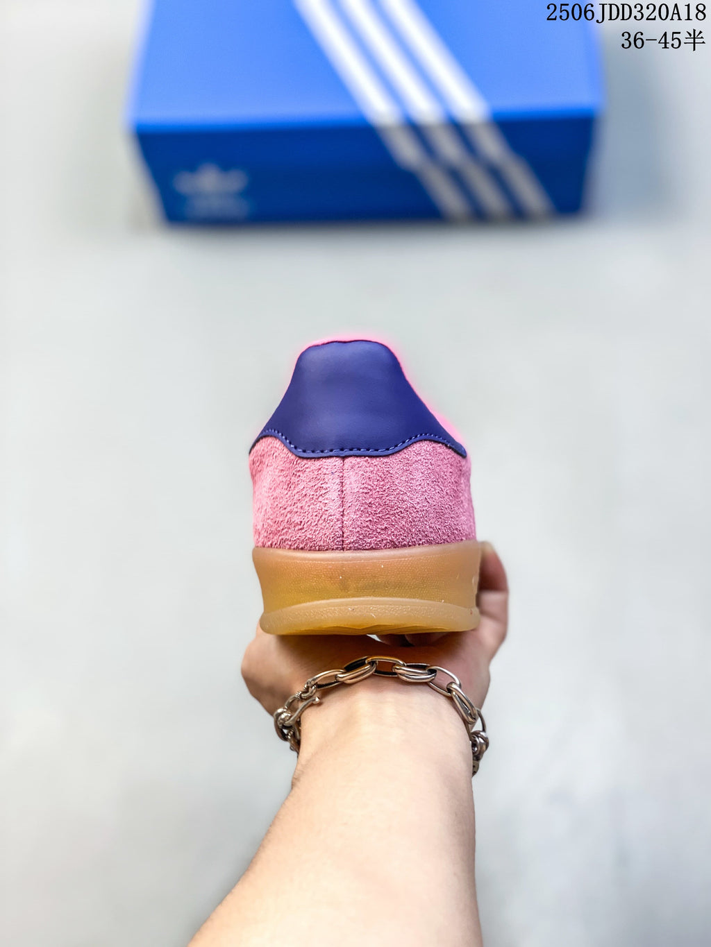 Rear view showing the pink textured upper, dark heel tab, and gum-look sole.