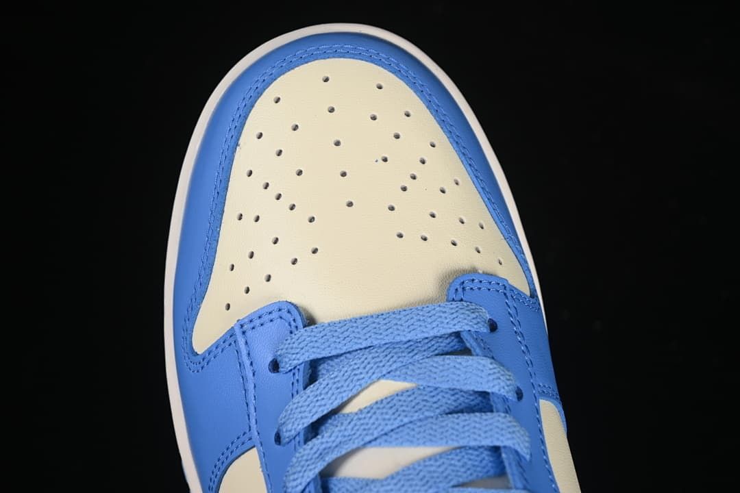 Top view of the perforated cream toe and blue laces